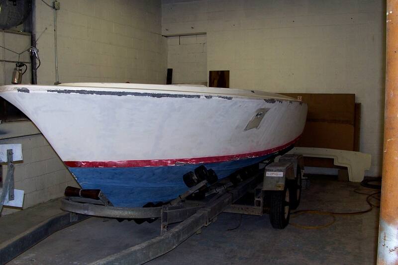 Hull in primer with patches in the shop