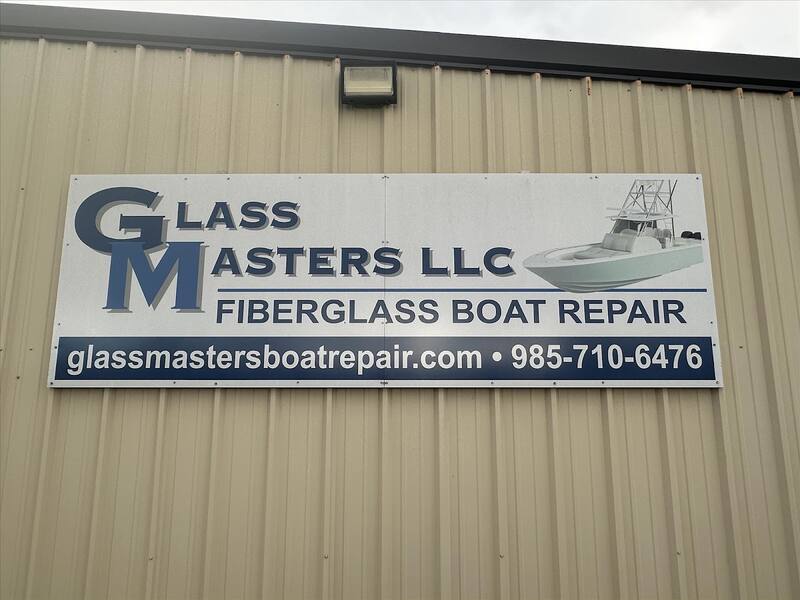 Glass Masters LLC sign on the metal shop building